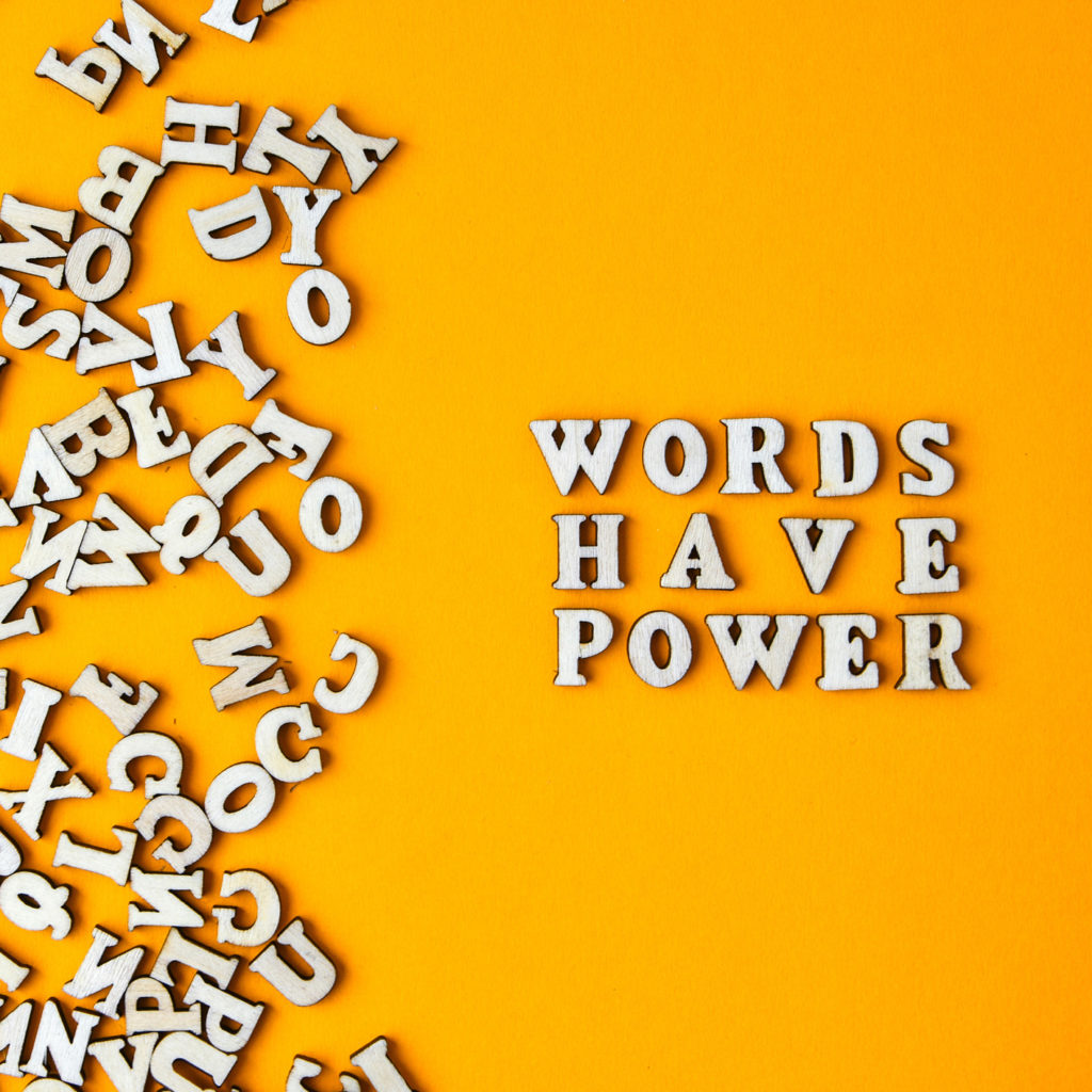 Quote WORDS HAVE POWER made out of wooden letters on bright yellow background. Motivational Words Quotes Concept