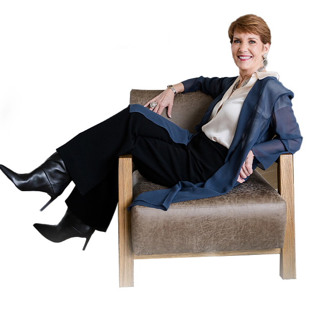 Melissa-sitting-on-sofa-chair-new Melissa-sitting-on-sofa-chair-new